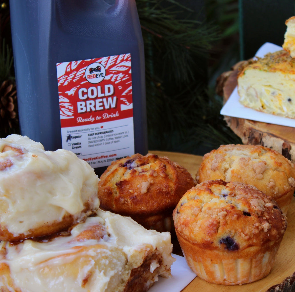 Holiday Bites breakfast catering package by RedEye Coffee in Tallahassee, FL. Includes muffins, cinnamon rolls, breakfast casseroles, and cold brew. 