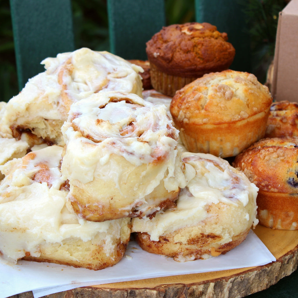 Family Feast breakfast catering package by RedEye Coffee in Tallahassee, FL. Includes cold brew, muffins, cinnamon rolls, breakfast casseroles, and a grazing box. 